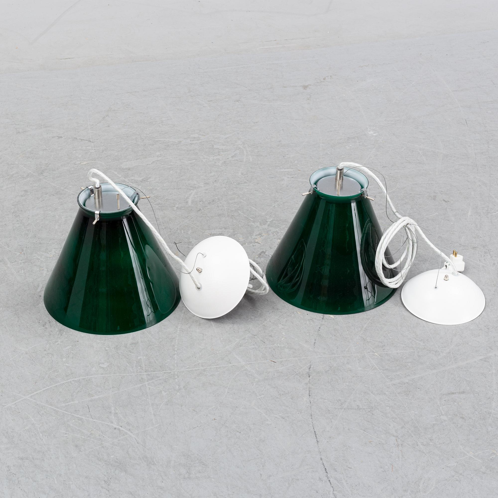 A pair of ceiling lamps in green and white glass, model no 4011, Zero.