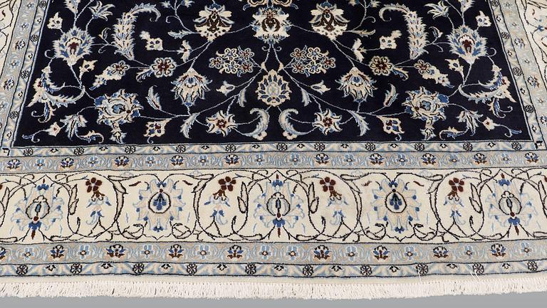 A carpet, Nain, part silk, ca 350 x 247 cm.