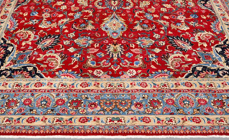 An old Meshed carpet, c. 342 x 252 cm.