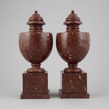 A pair of porphyry urns, presumably first half 20th century.