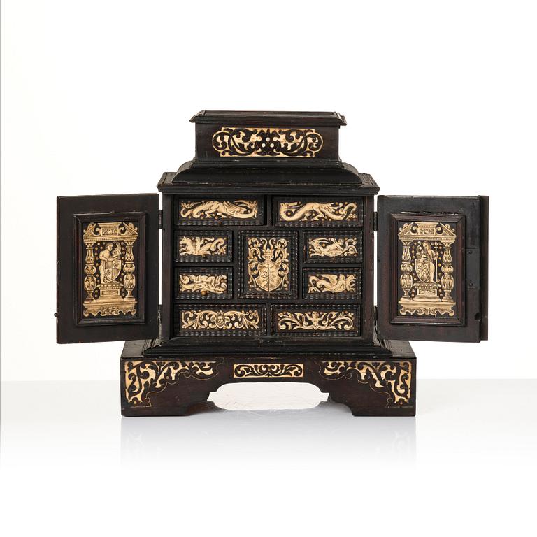 A South German, presumably Augsburg, ebony, ebonised and engraved bone inlaid table cabinet,  17th century.