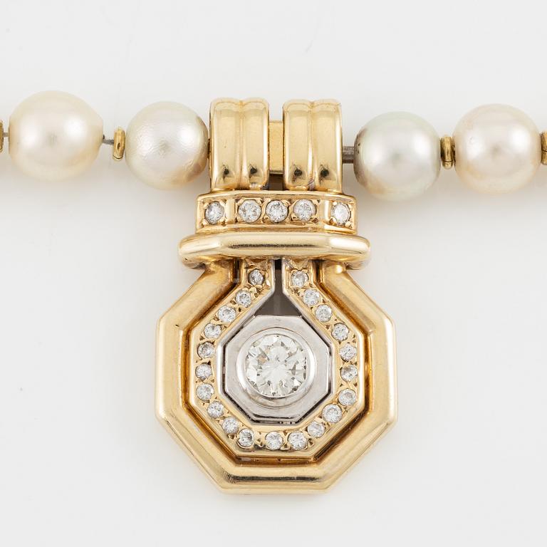 Pearl necklace with cultured pearls, pendant 14K gold set with brilliant-cut diamonds.