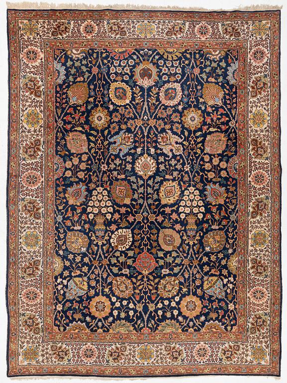 A semi-antique Tabriz carpet, c. 395 x 295 cm.