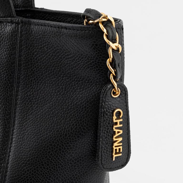 Chanel, a caviar leather tote bag.