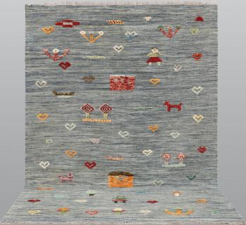 A Kelim carpet, figural, c. 236 x 171 cm.