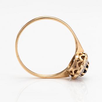A 14K gold ring with a sapphire and a diamonds ca. 0.10 ct in total.