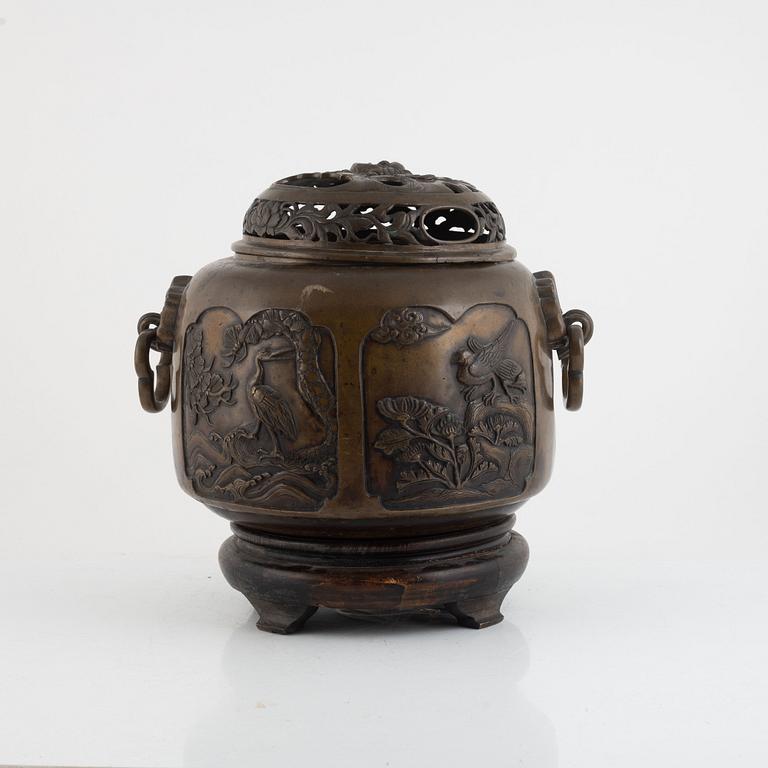 A bronze urn with stand, Japan, presumably Meiji (1868-1912).