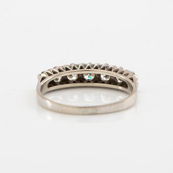 Half-eternity ring in 18K white gold set with round brilliant-cut diamonds.