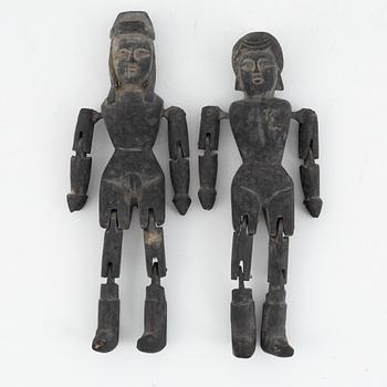 A pair of Chinese wooden dolls, early 20th century.