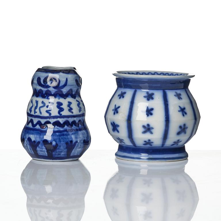 Wilhelm Kåge, a jar with cover, and four vases, creamware and porcelain, Gustavsberg, Sweden, 1917-1920.