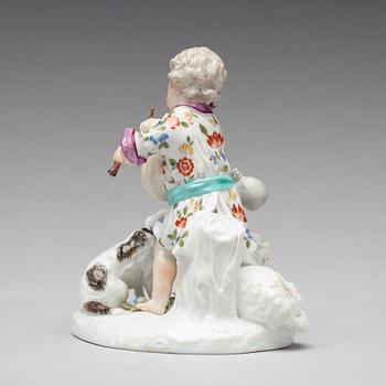 A Frankenthaler porcelain figure of a putto playing bag pipe, Germany, 18th Century.