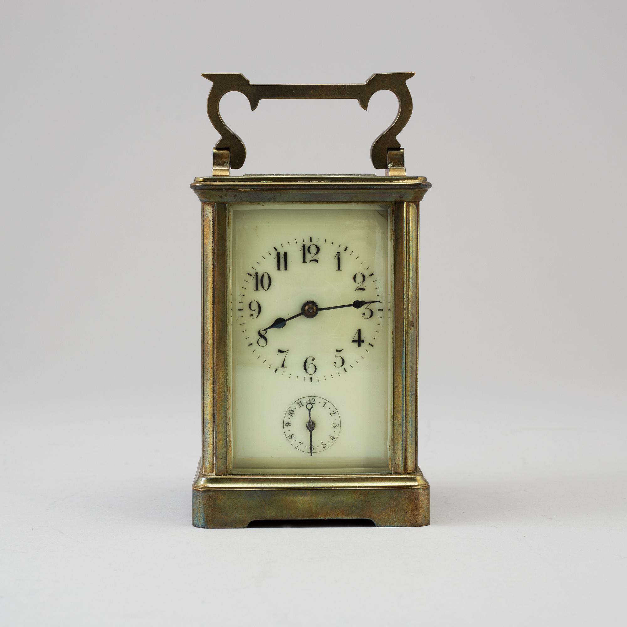An early 20th century brass and glass carriage clock.