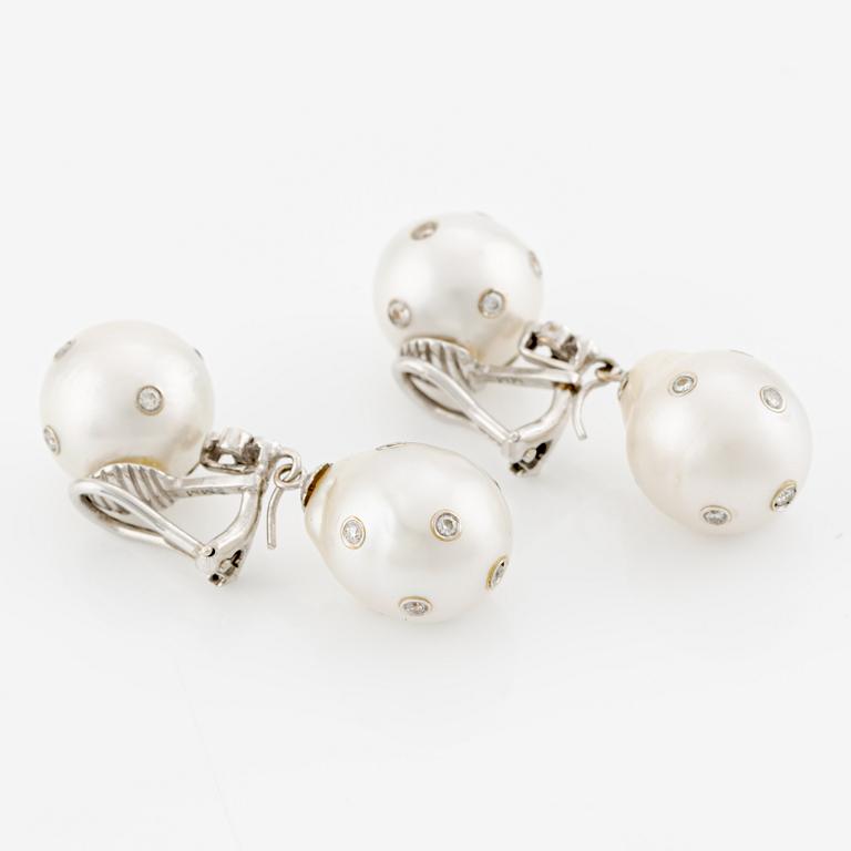 Earrings, a pair, with cultured South Sea pearls and brilliant-cut diamonds.