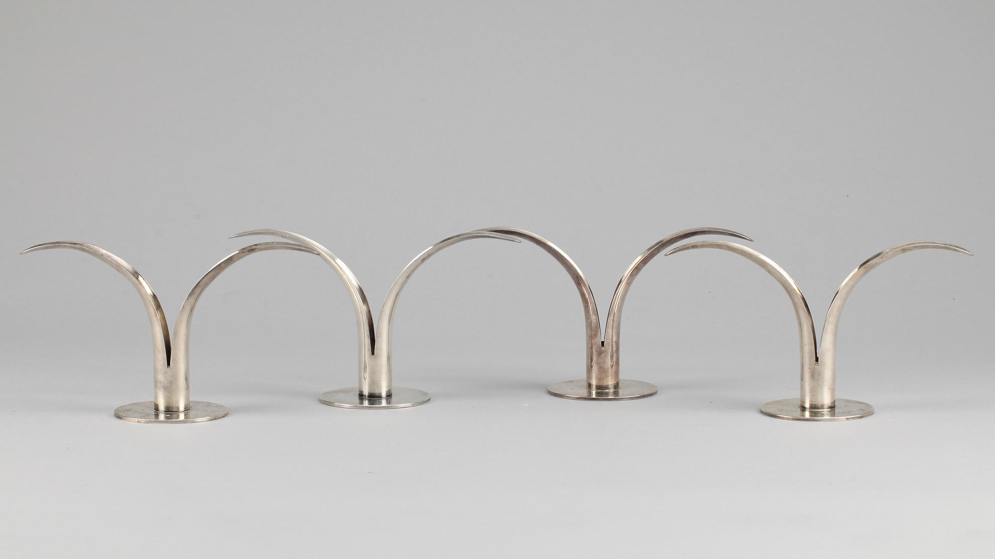 256212. LJUSSTAKAR, 4 st, nysilver, "Liljan", Ivar Ålenius Björk, Ystad metall, 1900-tal.