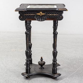 A porcelain and wooden mounted chess table, late 19th century.