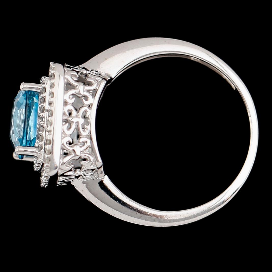 RING, 14 k vitguld, blå topas, diamanter tot ca 0.17 ct.
