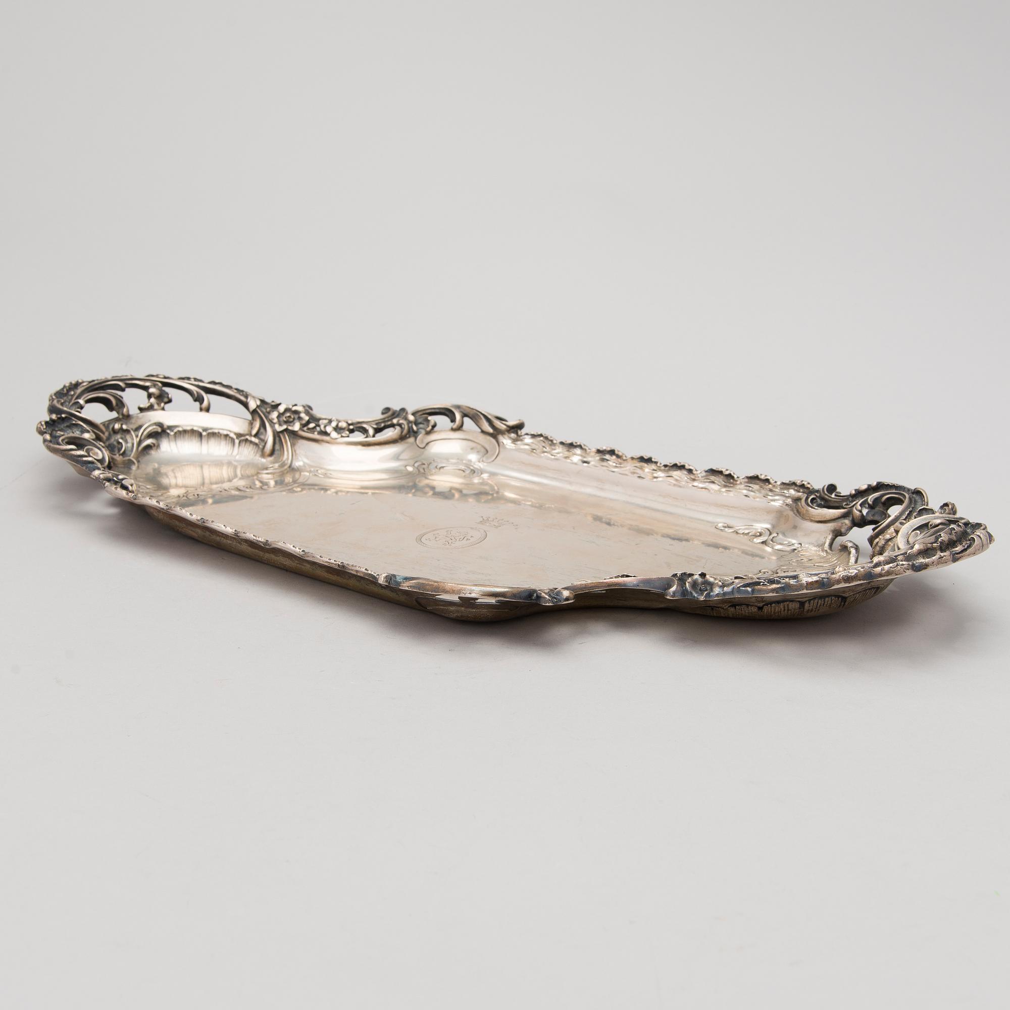 A German silver tray, mark of M.H. Wilkens & Söhne, Austrian import mark, retailer mark of V. Mayers Söhne, 1891-1901.