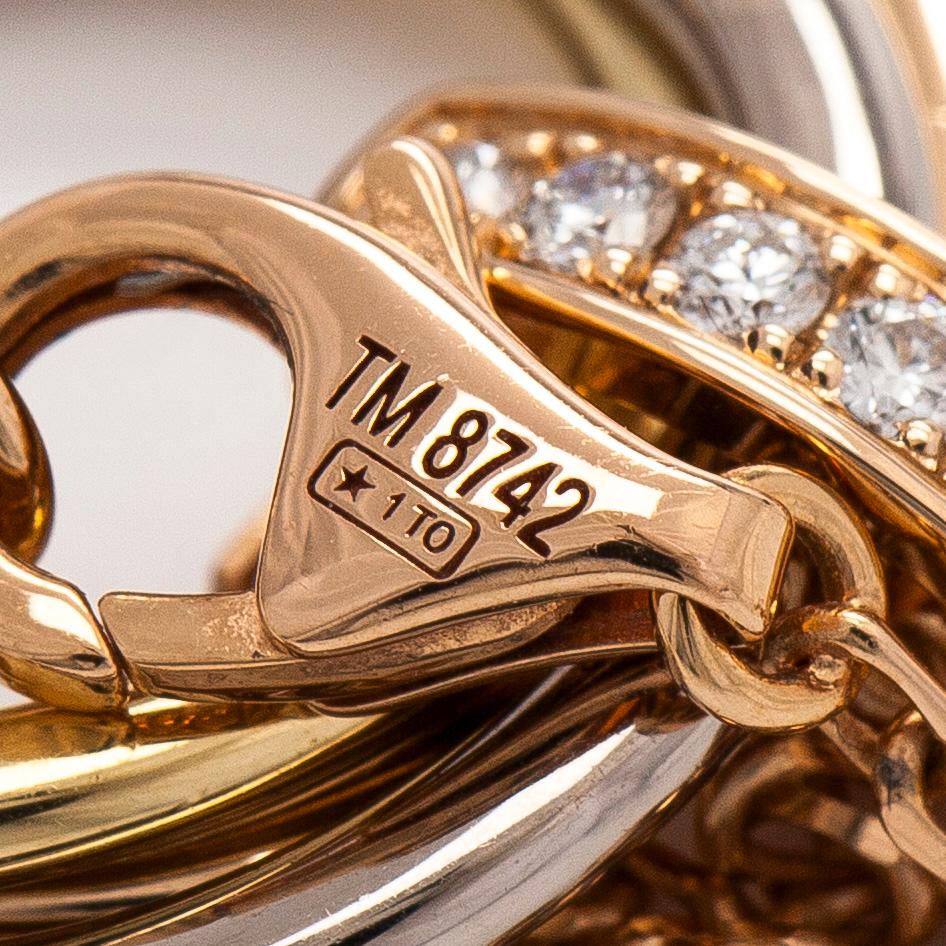 Cartier, an 18K gold 'Trinity Pendant' necklace with brilliant-cut diamonds.