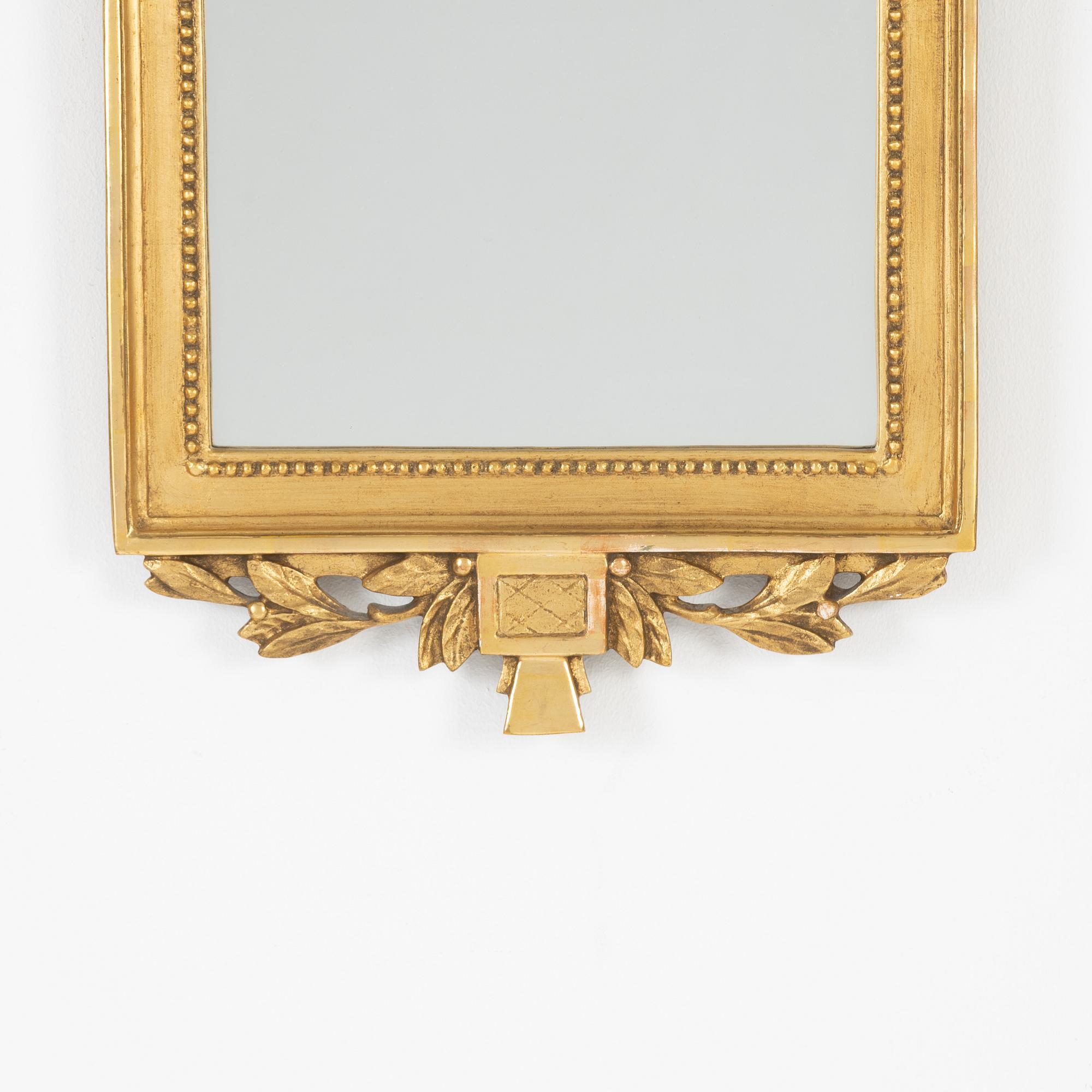 A Gustavian style mirror, mid 20th Century.