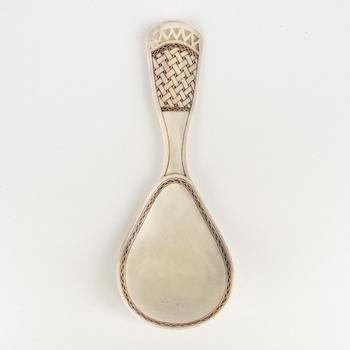 A horn spoon by Folke Fjällström, signed and dated -78.