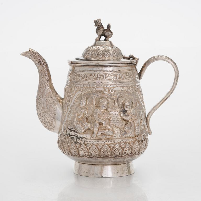 A silver teapot, China.