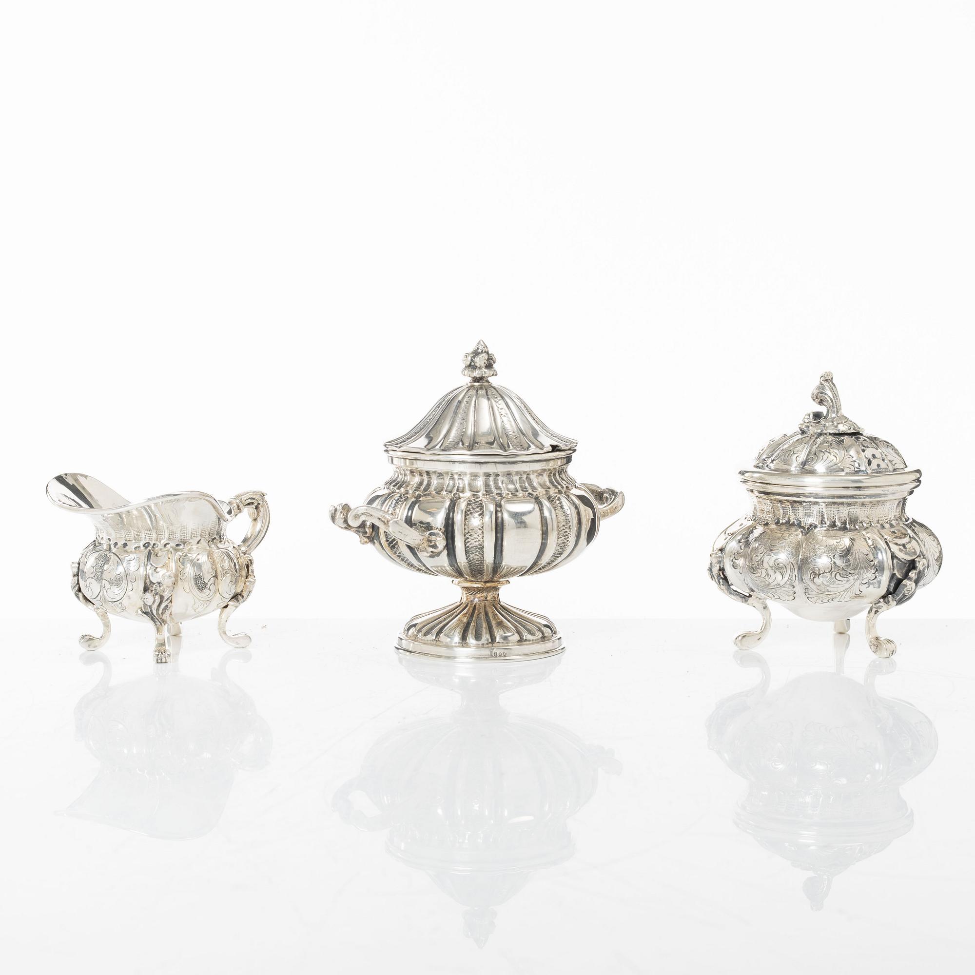 A silver sugar bowl and a set with creamer and sugar bowl, silver, 20th century.