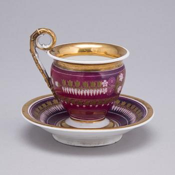 AN EMPIRE PORCELAIN CUP AND SAUCER, first half of the 19th century.