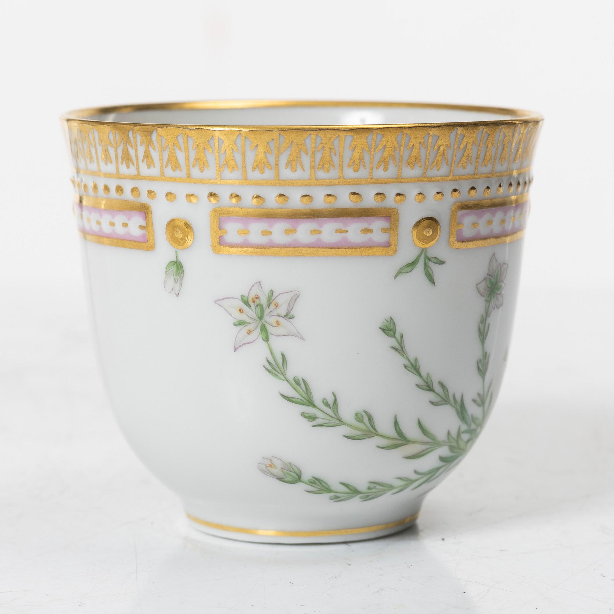 A Royal Copenhagen 'Flora Danica' coffee cup with stand, Denmark, 20th Century.