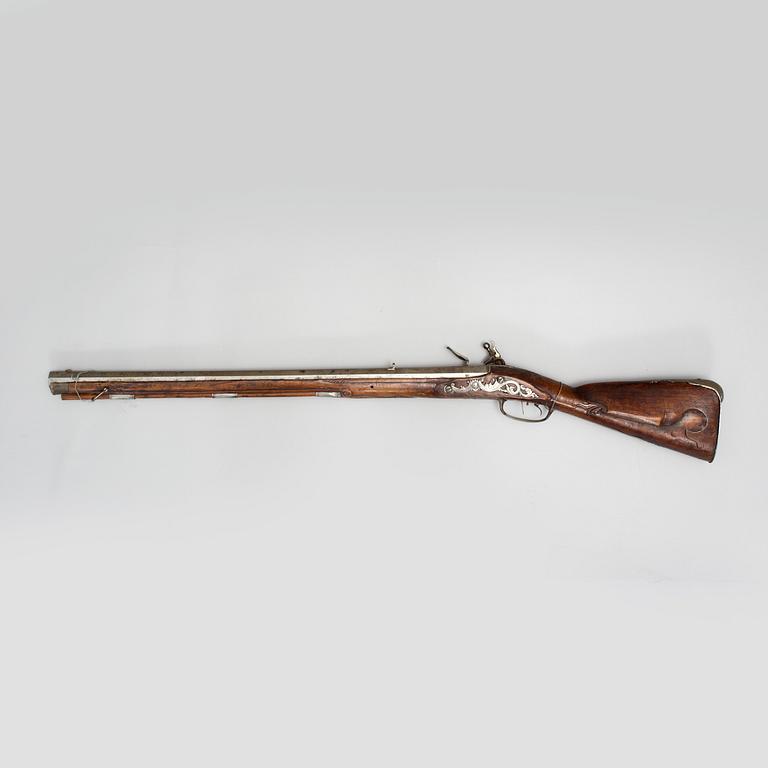 A 18th century flintlock rifle.