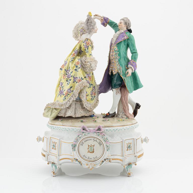 A rococo style porcelain figurine from the early 20th century.