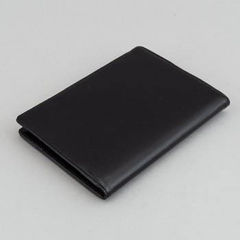 MOntblanc, a ball point pen and leather passport holder.