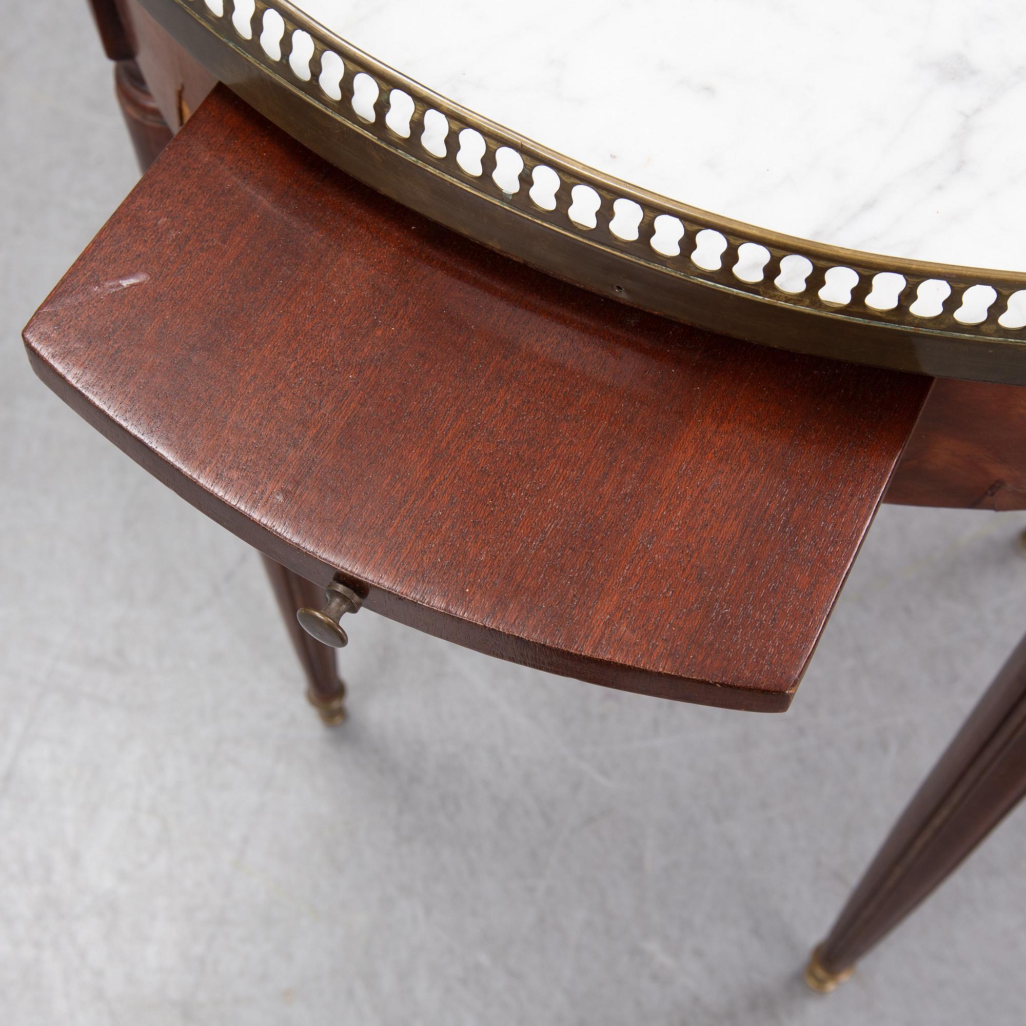 A Louis XVI style marble top mahognay table, circa 1900.