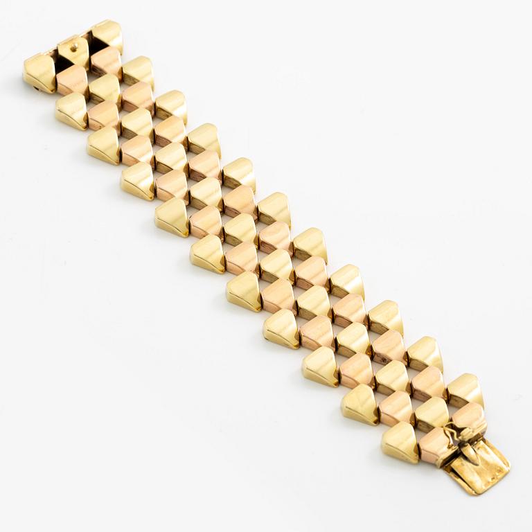 A bracelet 14K gold in two colours.