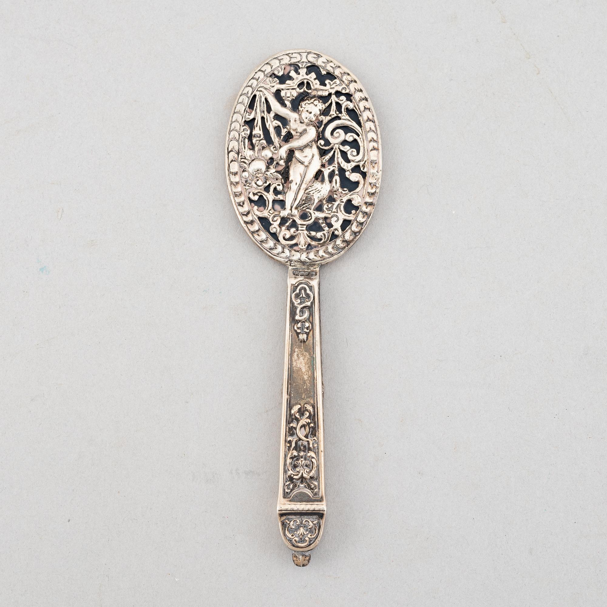 Goblet on foot, hand mirror, and box, silver.