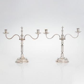 A pair of silver candelabra by Ferdinand Christian Krebs, Breslau, 1776-1792, with snuffers from Reval. Neo-classicism.