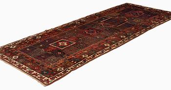 An antique Kurdish / Turkish carpet by the Herki Tribe, ca 276 x 116 cm.