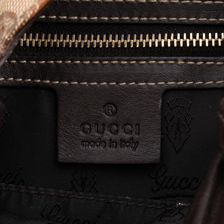 Gucci, a canvas handbag.