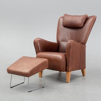 A 'Stepp' easy chair width stool by Carl-Henric Spak for Swedese.