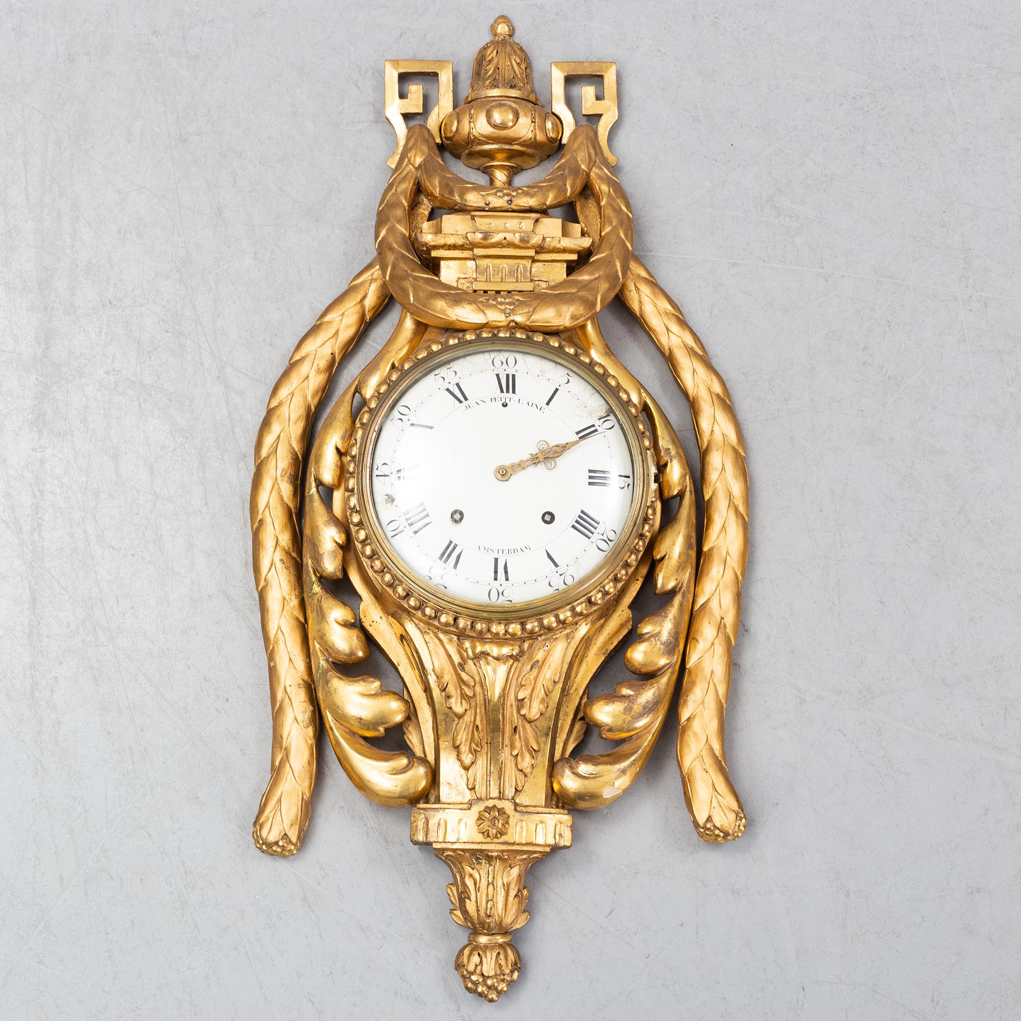 An 18th century Louis XV wall clock Jean-Petit L´Aine, Amsterdam.