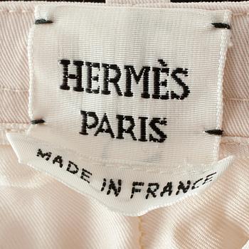 HERMÈS, a pair of creme colored silk pants.
