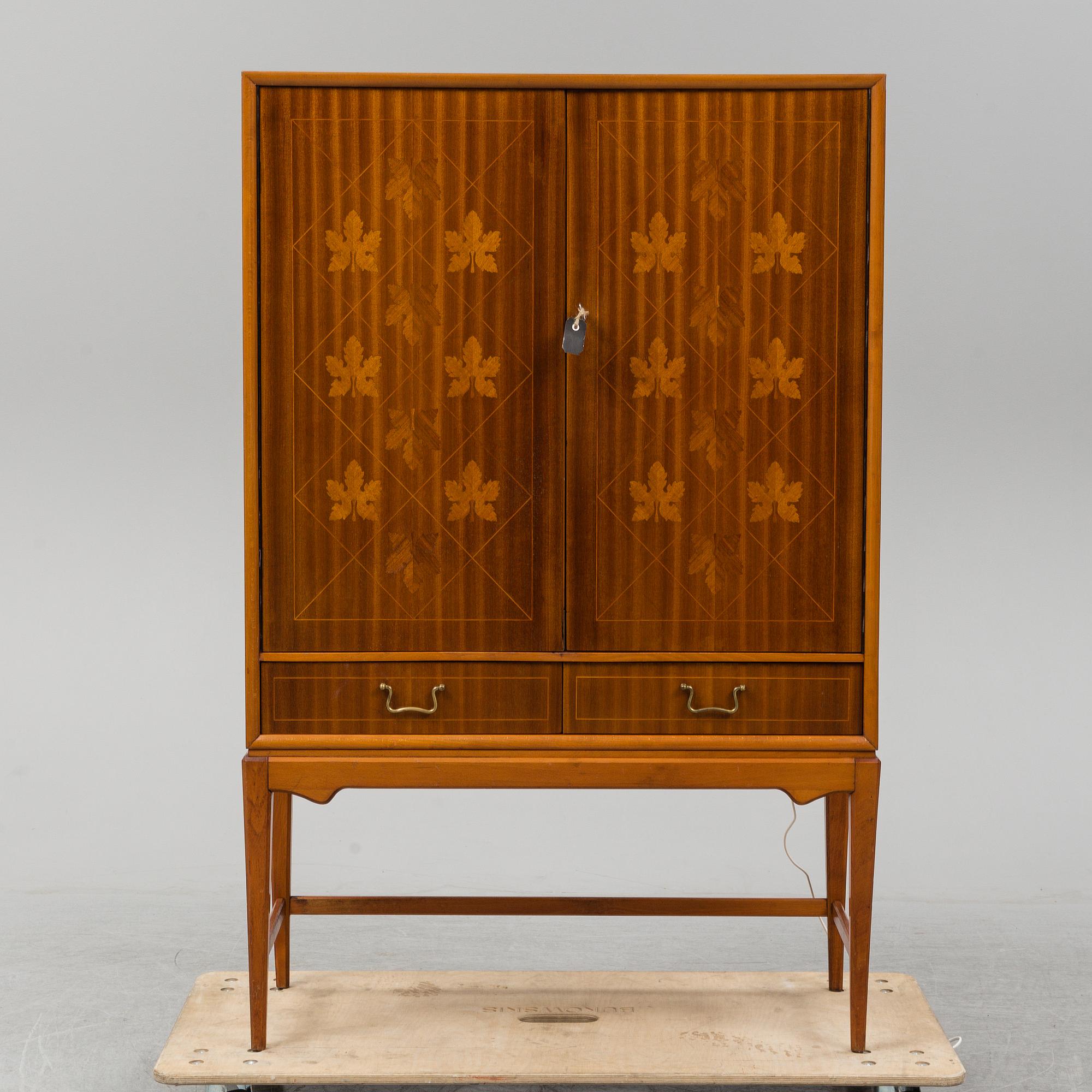 A mid 20th Century bar cabinet.
