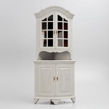 A Gustavian style 20th century corner cabinet.