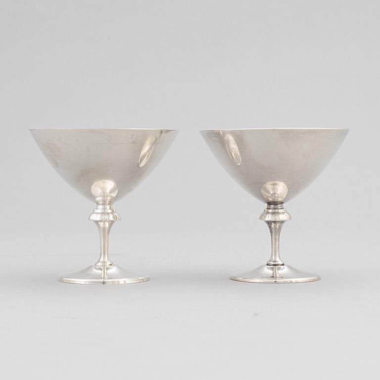 A silver plated shaker, C.G. Hallberg and a set of twelwe cocktail glasses, GAB, second half of the 20th Century.