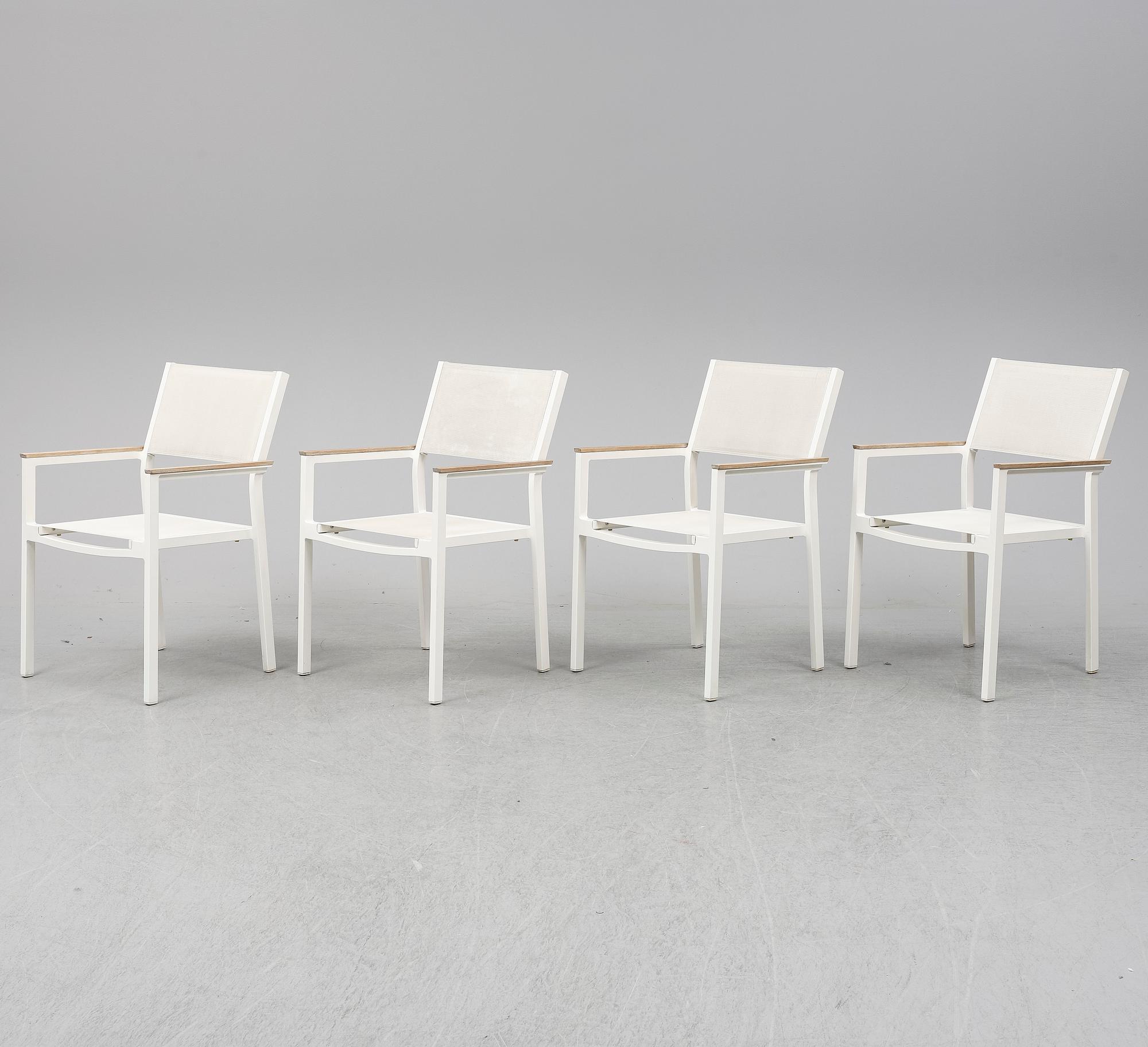 A garden table with four chairs, Gloster.