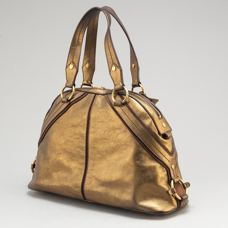 YVES SAINT LAURENT, a metallic bag.