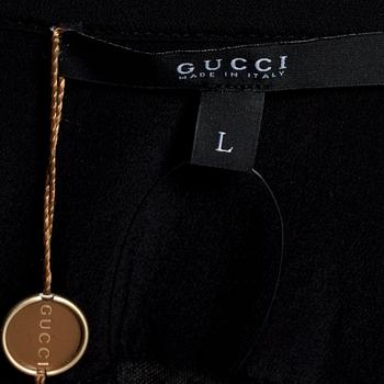 GUCCI, a black cashmere and silk tuxedo shirt.