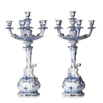 473. A pair of Royal Copenhagen 'Musselmalet' / 'blue fluted full lace' six-light candelabras, Denmark, 1898-1923.
