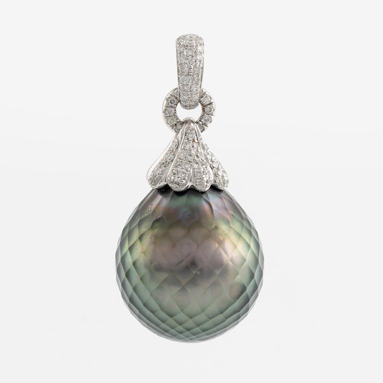 Carved cultured Tahiti pearl and brilliant cut diamond pendant.
