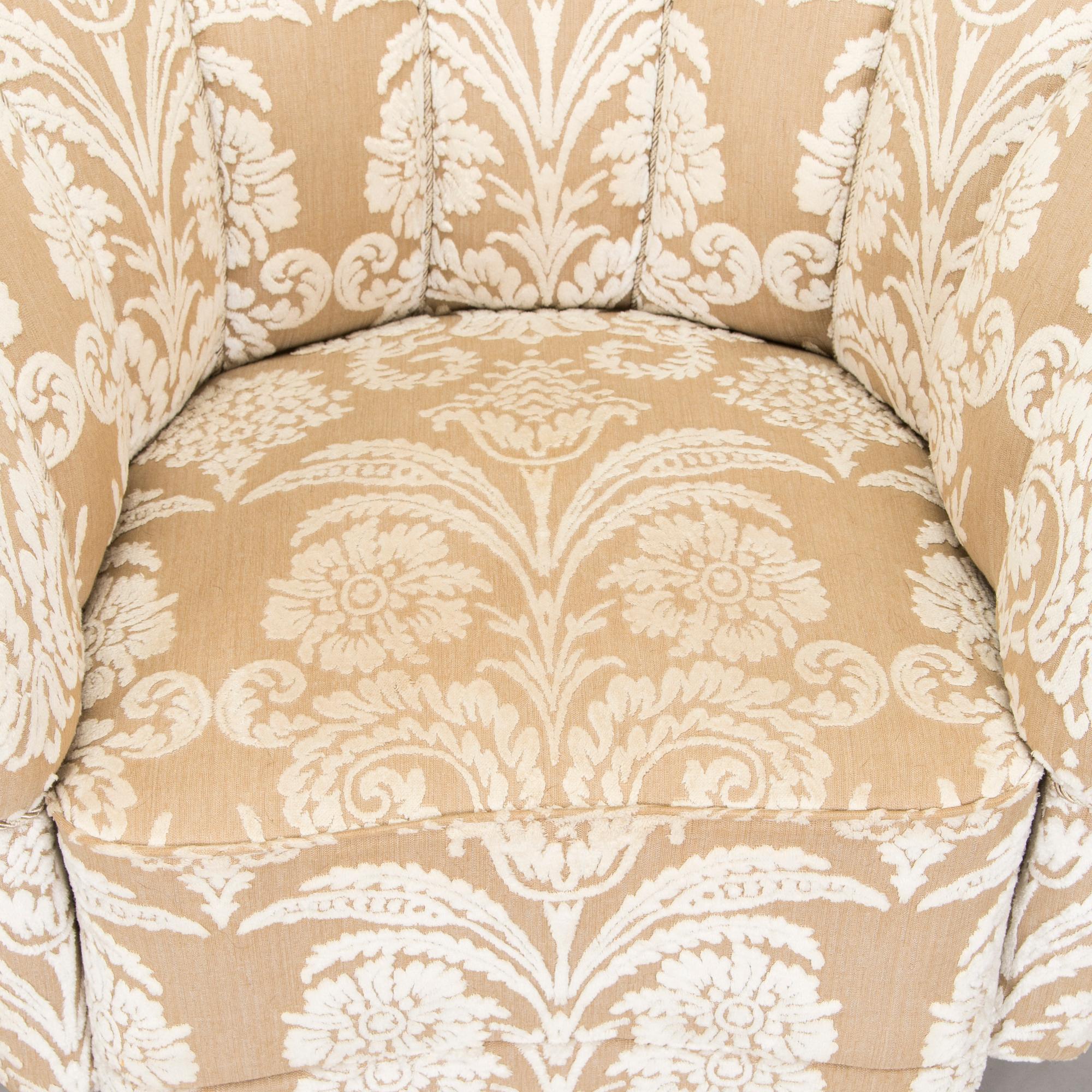 A pair of mid-20th century armchairs.