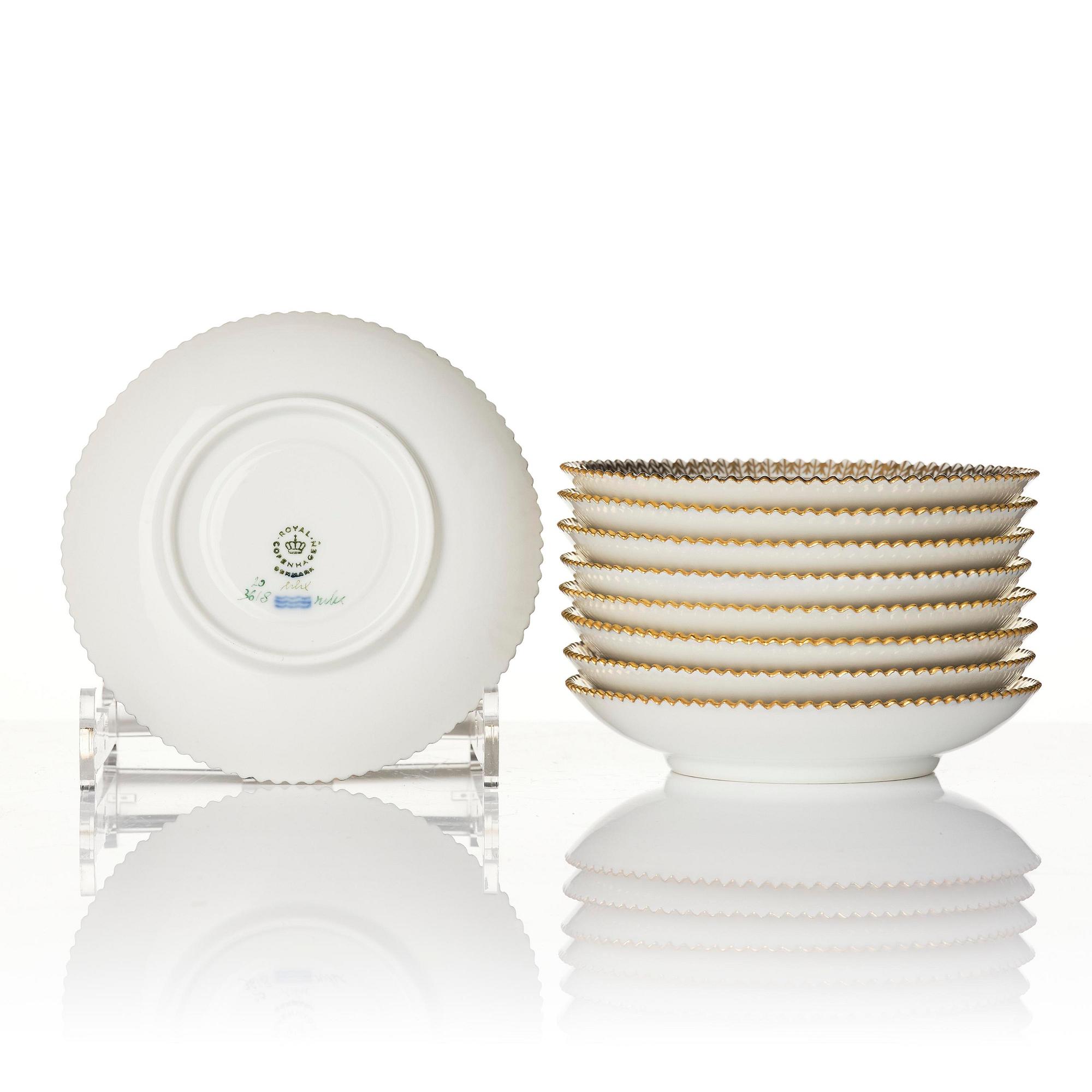 A set of nine Royal Copenhagen 'Flora Danica' cups with saucers, Denmark, 20th century.